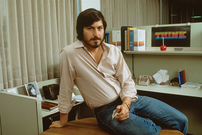 A young Steve Jobs in his office