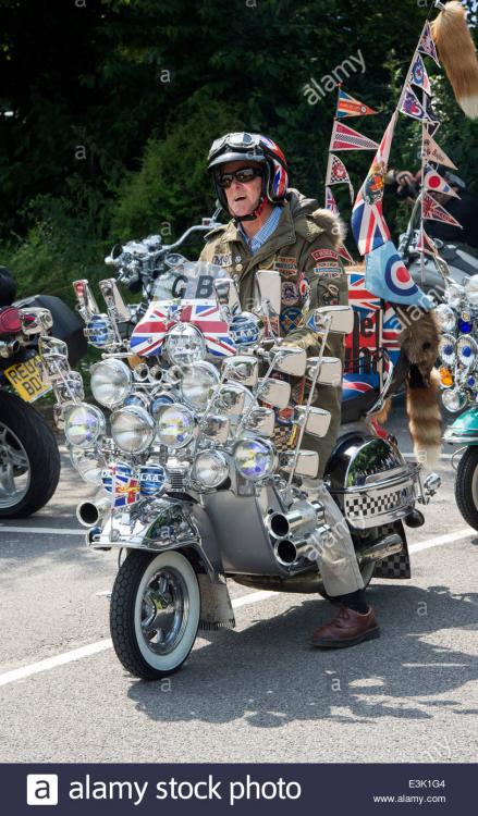 old-mod-riding-on-his-vespa-custom-scooter-with-mirrors-lights-logos-E3K1G4.jpg